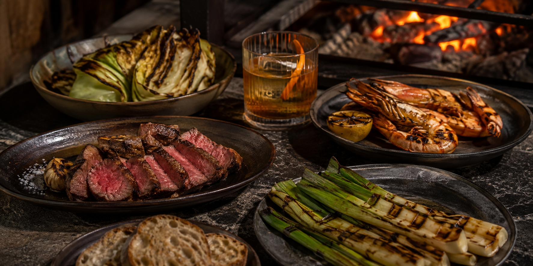 Pièces grillées, légumes au feu, langoustines et cocktail à partager